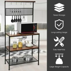 Costway 4-Tier Kitchen Bakers Rack Microwave Oven Stand Industrial W/Hooks & Mesh Panel -Famous Furniture Store GUEST 96ef8627 557a 47f9 8f14 9ecfa1ee8faf